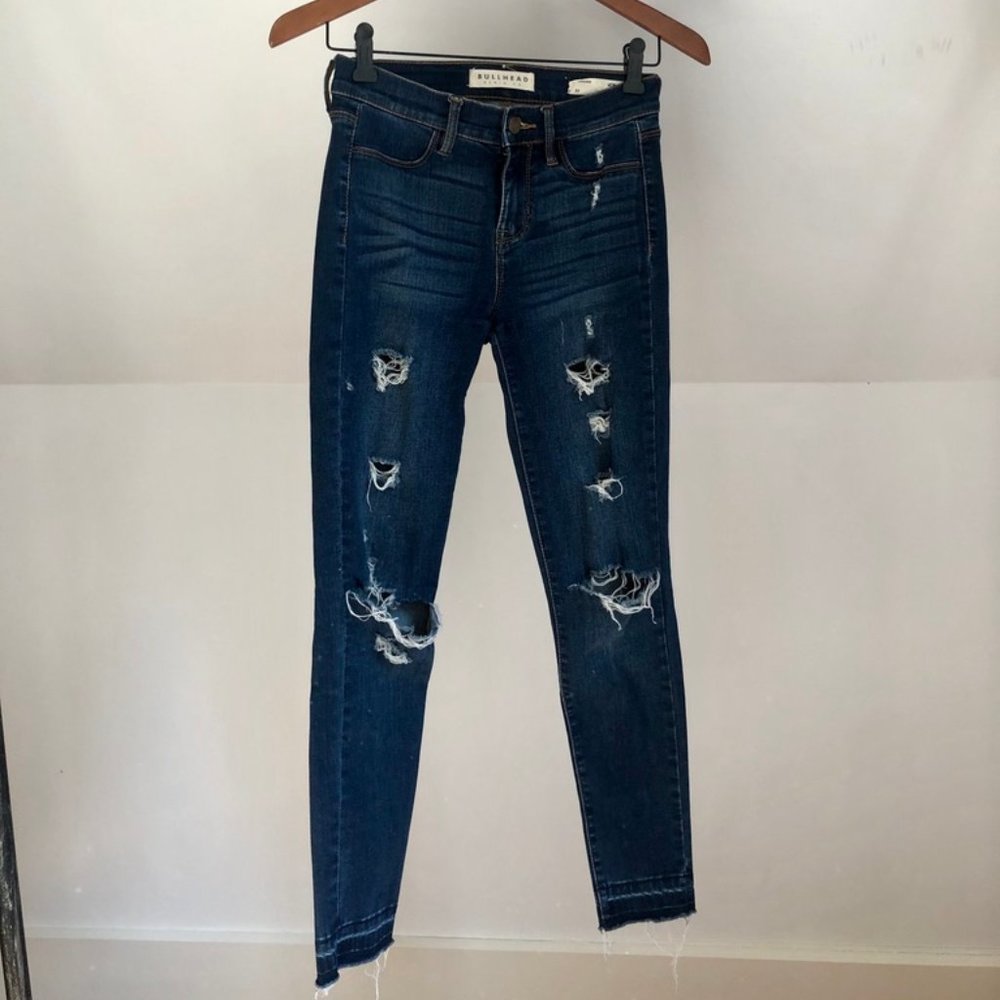 High waisted distressed blue jeans
